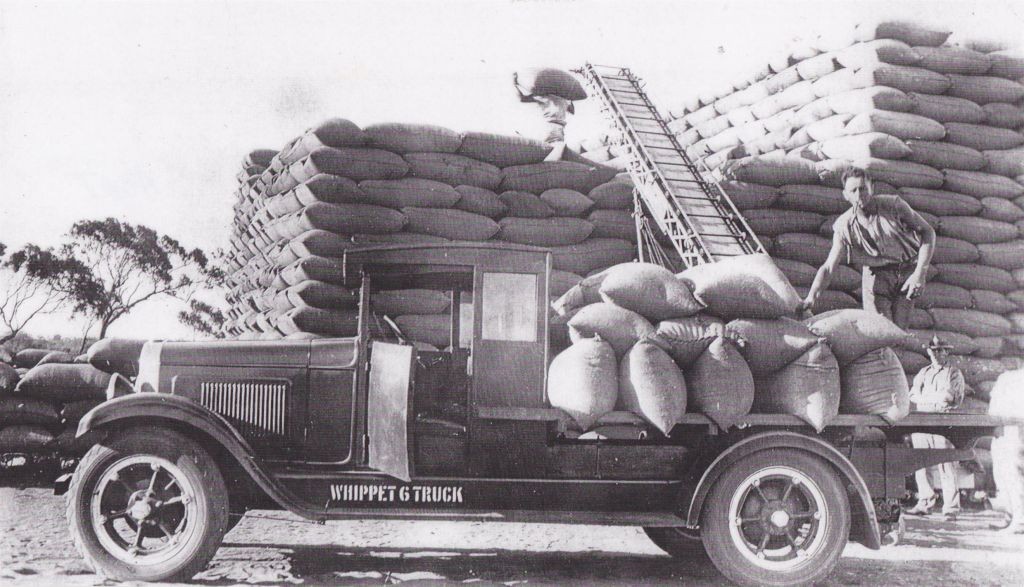 Ralph Short unloading bagged wheat at Tenindewa 1930s